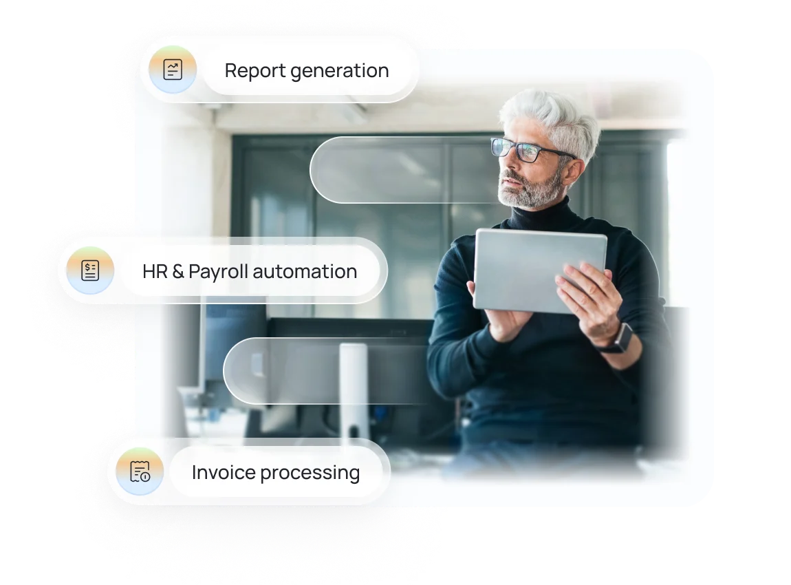 Man with gray hair and glasses holding a tablet, with overlay text highlighting report generation, HR & payroll automation, and invoice processing.